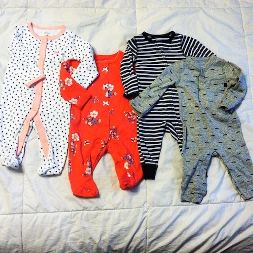 baby clothing on a bed Twins Sexes a Surprise