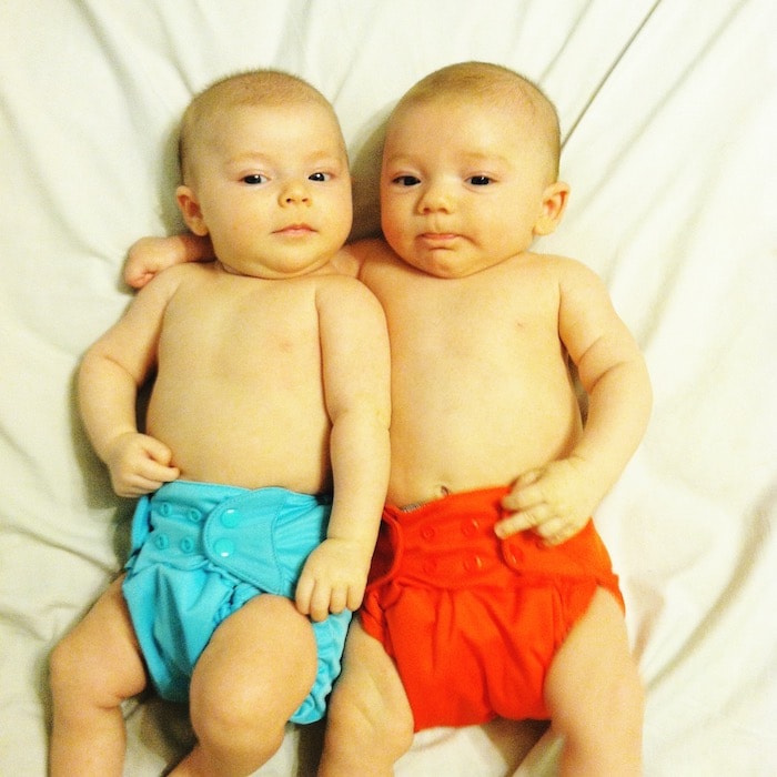 twin infants on a bed Twins Sexes a Surprise