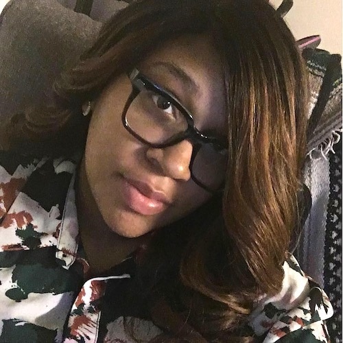 woman wearing glasses and new hairstyle after becoming a mom