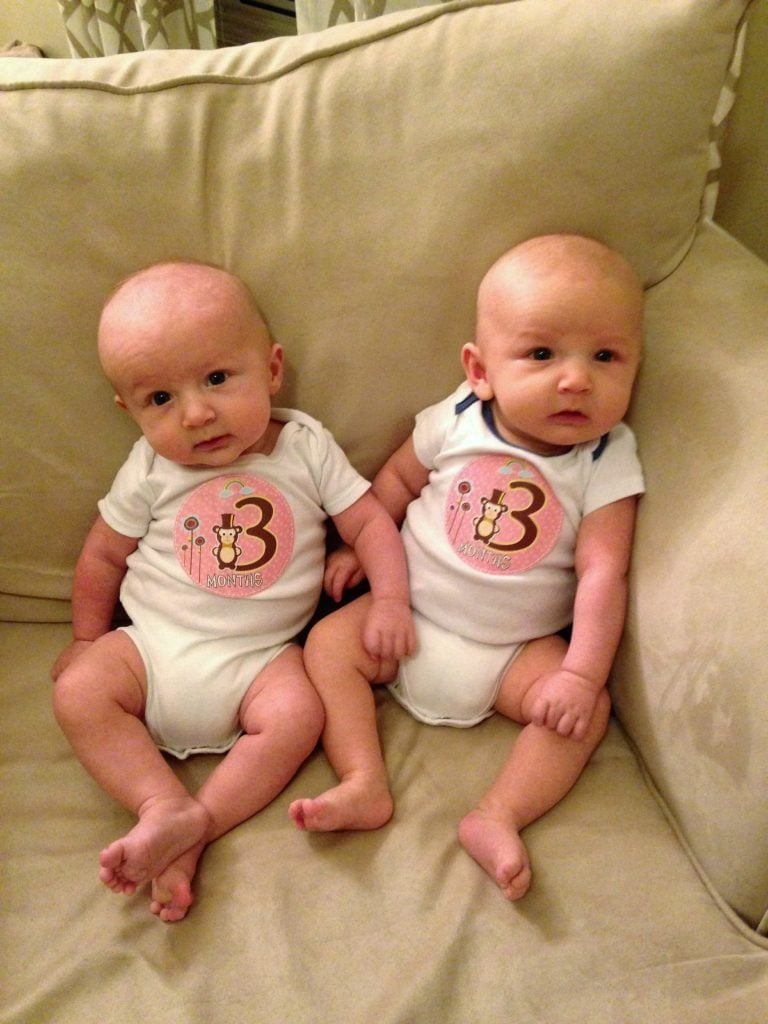 infant twins sitting on a couch mother-in-law taught