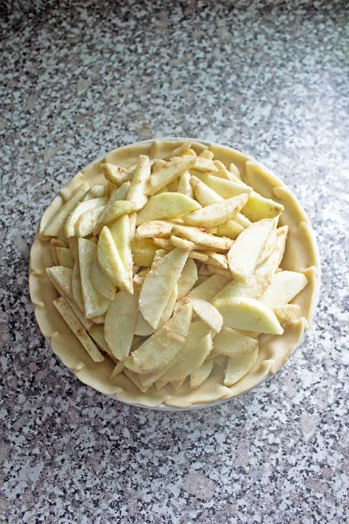 raw apples in a raw apple pie crust