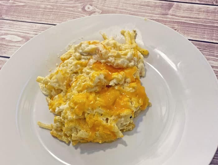 close up of cheesy potato casserole on a plate