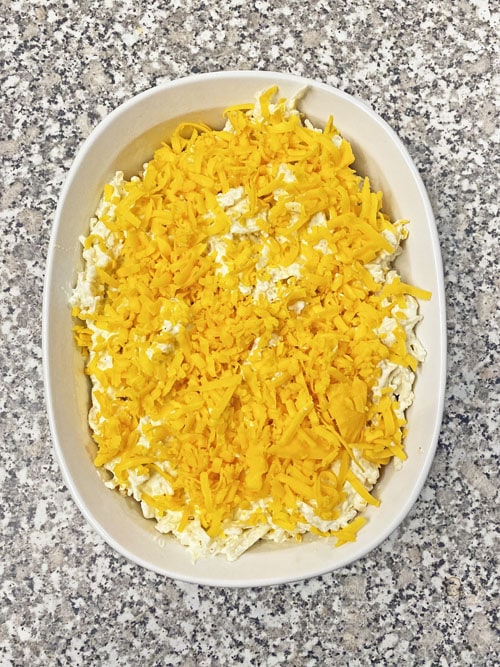 uncooked dish of cheesy potato casserole