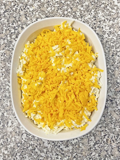 uncooked dish of cheesy potato casserole