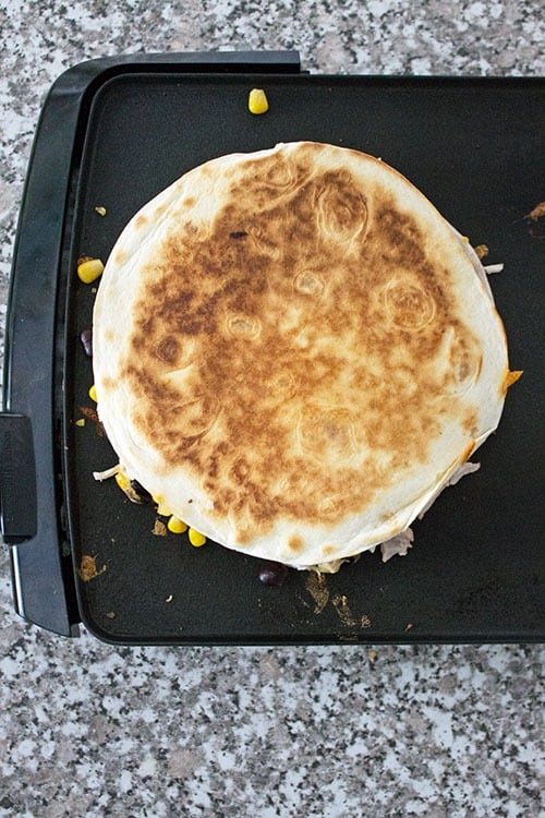 chicken quesadillas on a griddle