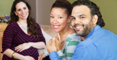 Happy Couple with surrogate mother