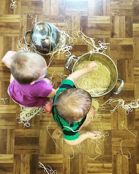 toddler twins playing with pasta on the floor 11 Twin Mom Observations