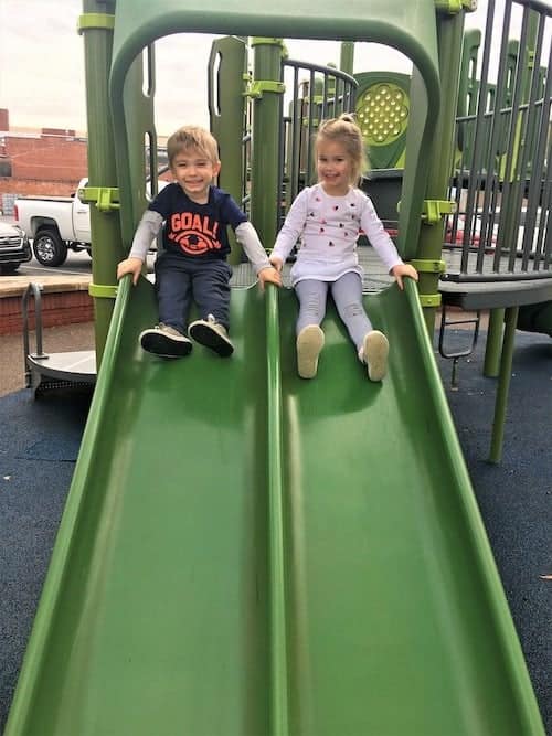 twin kids playing on the slide twins your excuse 