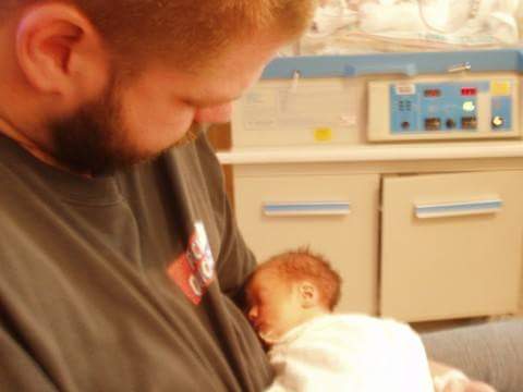 dad holding newborn baby