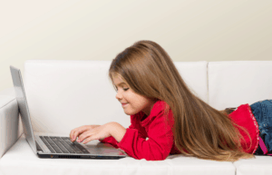free educational resources girl on couch with laptop