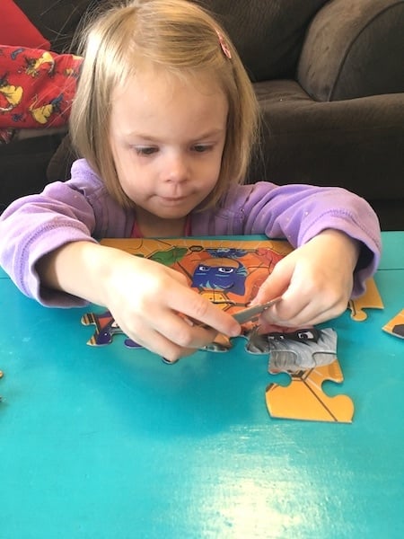 girl doing a puzzle love of math