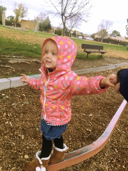 girl balancing on beam at park preschool schedule