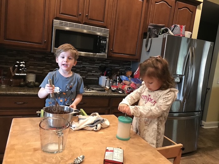 two little kids cooking