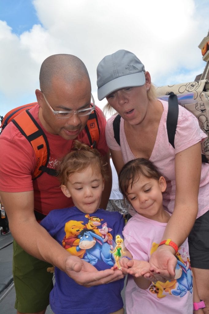 family posing for photo disney world with twins