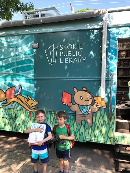 kids in front of bookmobile learning over summer break