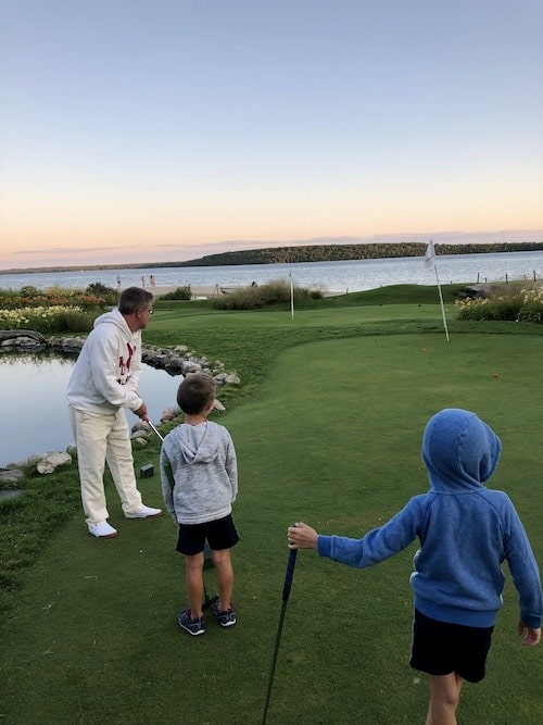 family playing mini golf mackinac island lodging