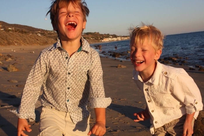 advocate for my kids twin boys laughing on the beach
