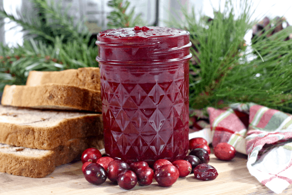 jar of cranberry jelly on a table