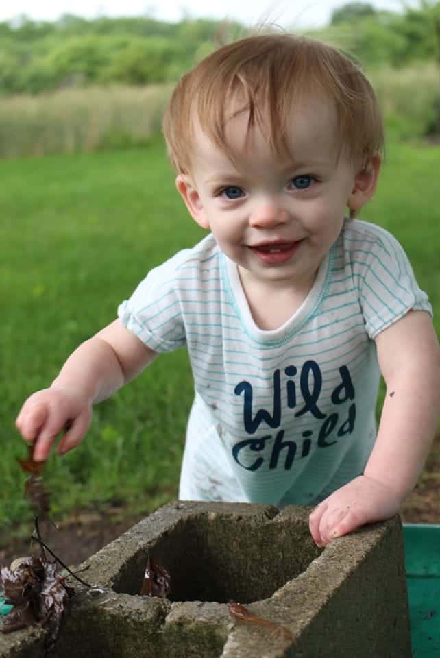 toddler boy in backyard why are you covered in poop