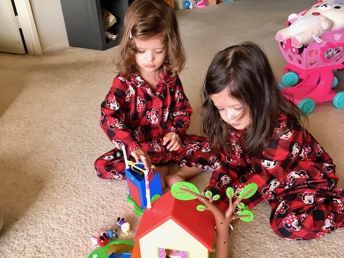 twin girls sharing toy Sharing Between Twins