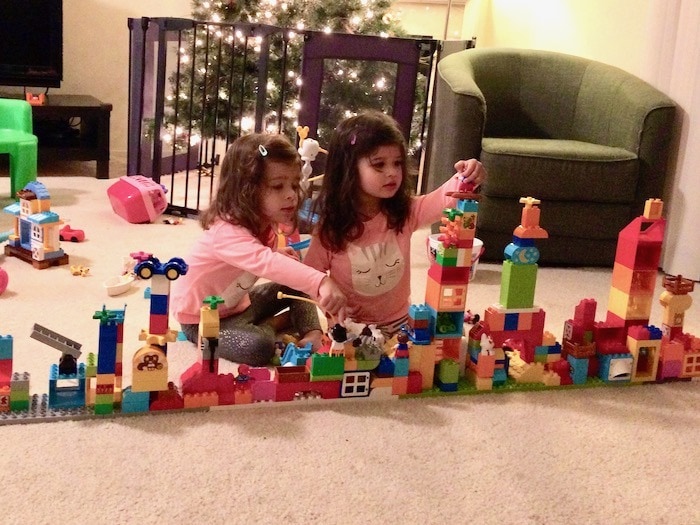 twin girls building with blocks Sharing Between Twins