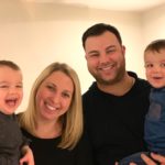 mom and dad with twin boys finding the humor