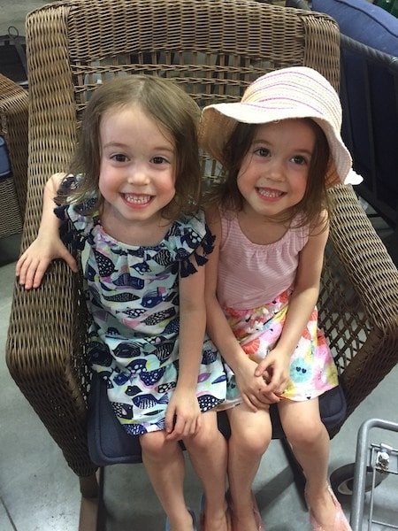 twin girls in a chair pros and cons of identical twins