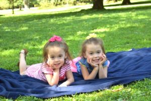 twin girls on a blanket pros and cons of identical twins