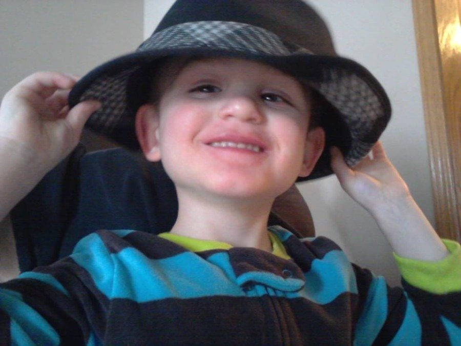 boy wearing hat autism