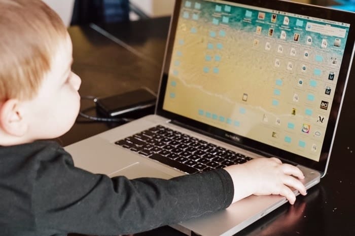 kid at laptop losing your digital photos