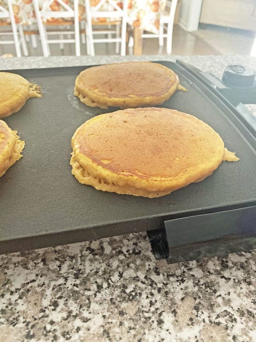 pumpkin pancakes on a griddle