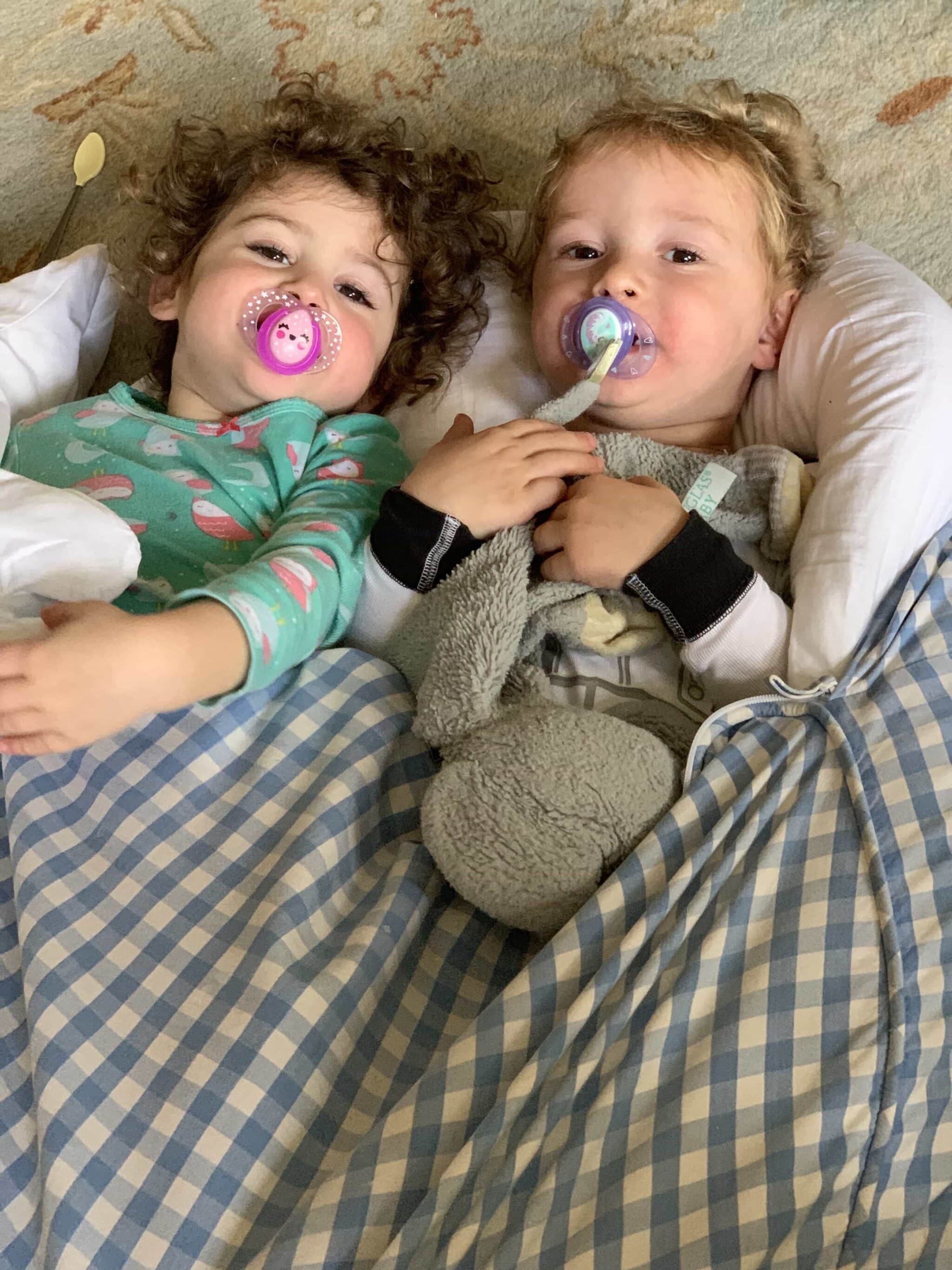 toddler twins under a blanket Preparing Your Babysitter