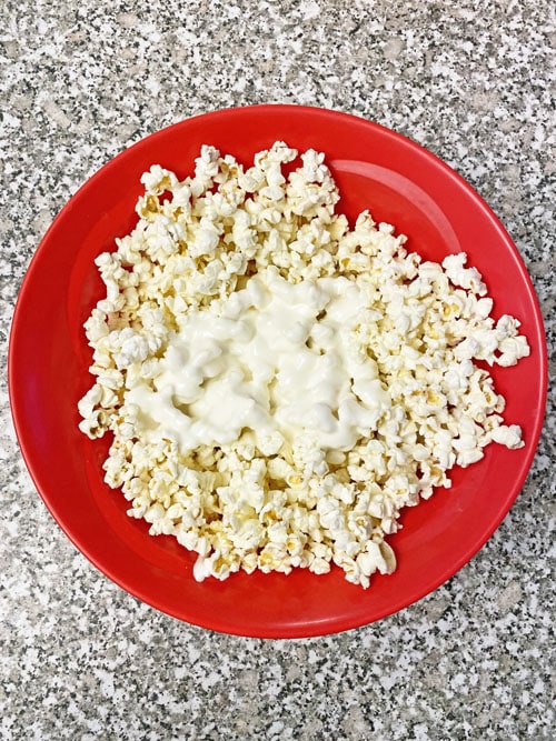 popcorn and marshmallows in a red bowl