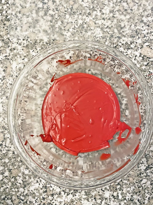 red candy melted in a glass bowl