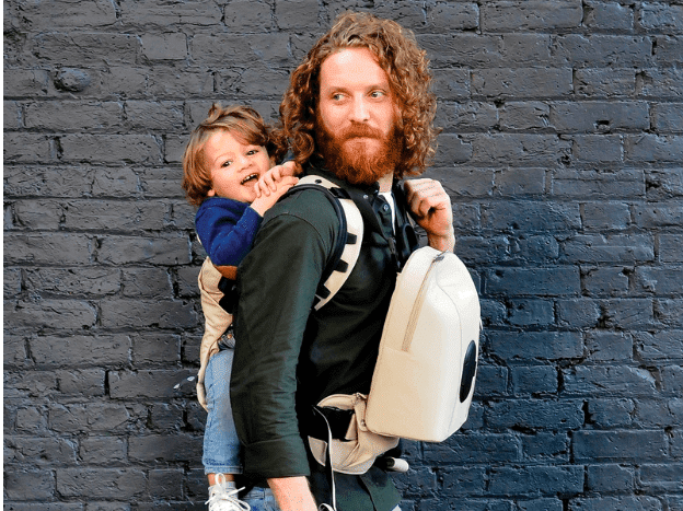 dad wearing toddler on his back babywearing