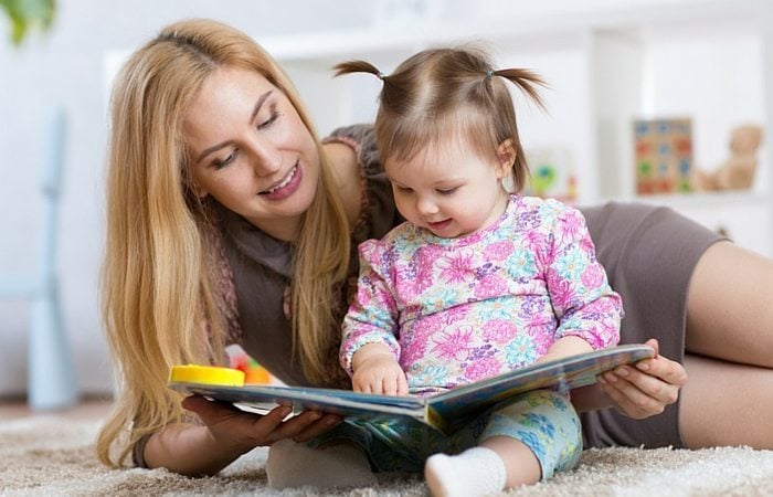 woman reading with baby