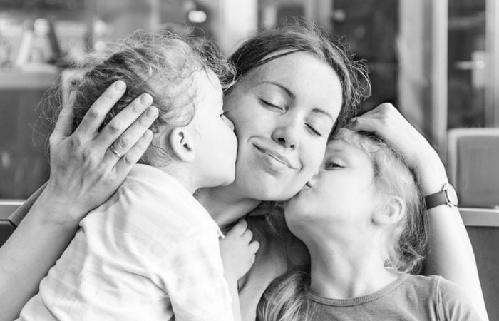 twins kissing mom working parents of twins