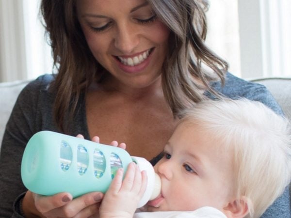 Dr Brown's mom feeding baby bottle