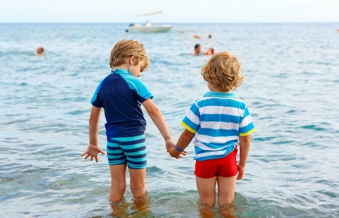 siblings holding hands 