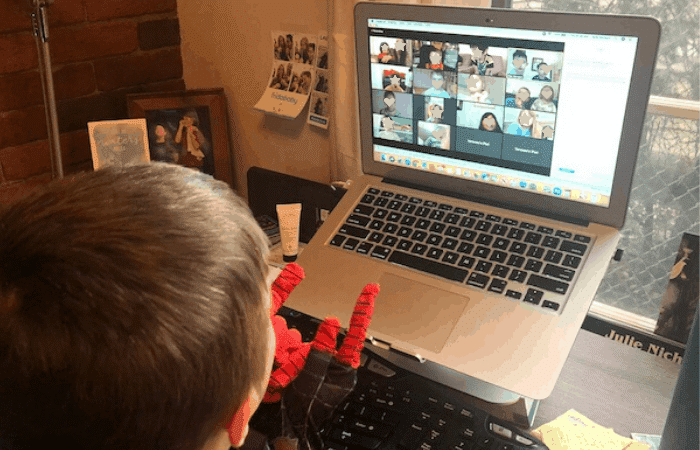 zoom meeting playdate boy on the computer back to school bash