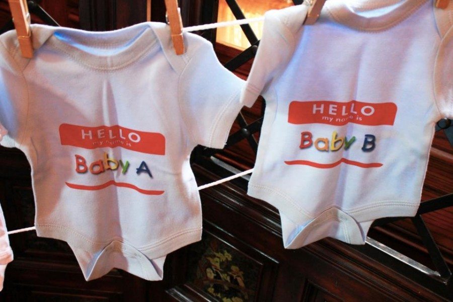 twin onesies on a clothesline twin baby shower etiquette