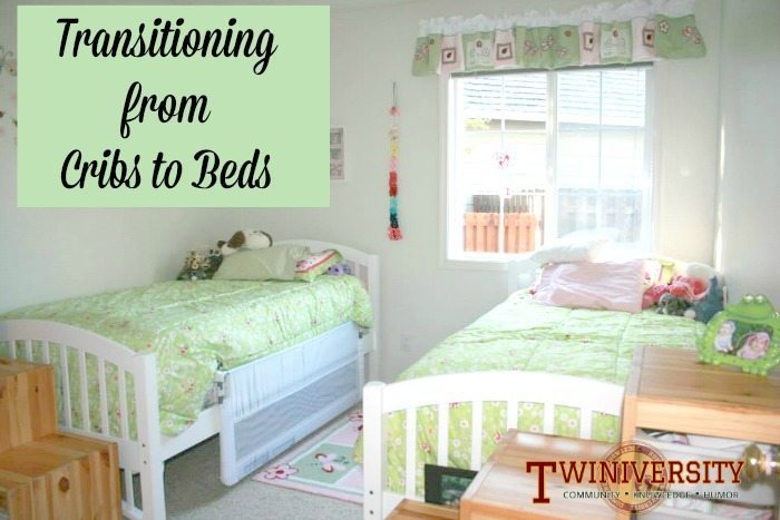 twin bed and crib in small room