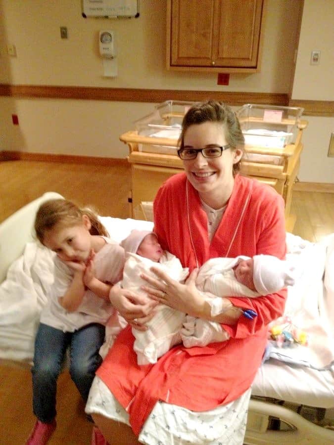 twin birth plan mom holding newborn twins
