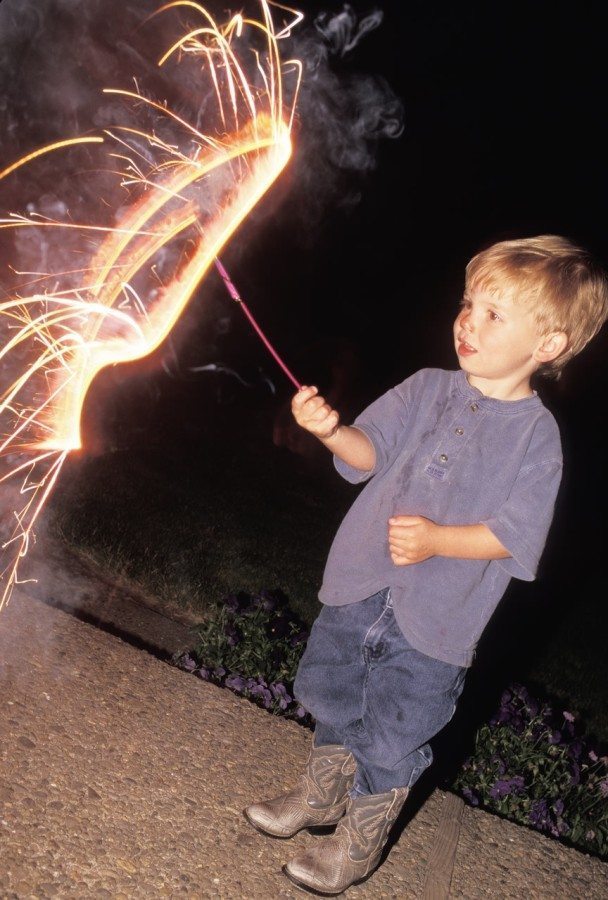 Boy holding sparkler