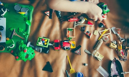 Boy and Girl Twins pile of toys