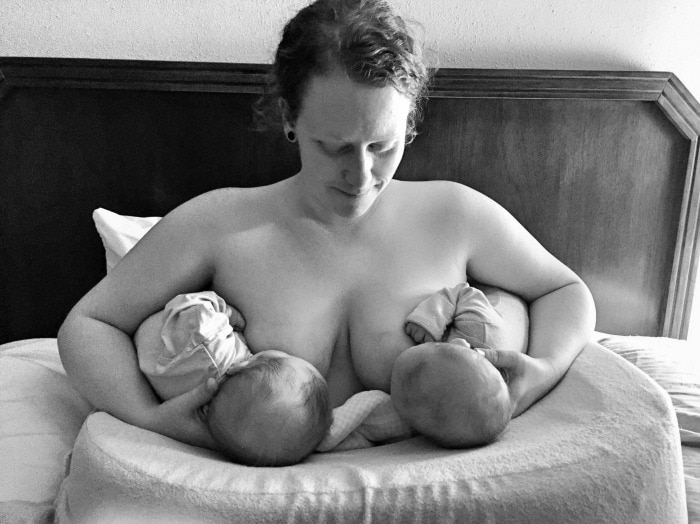 mom tandem breastfeeding infant twins