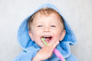 boy brushing teeth oral care routine