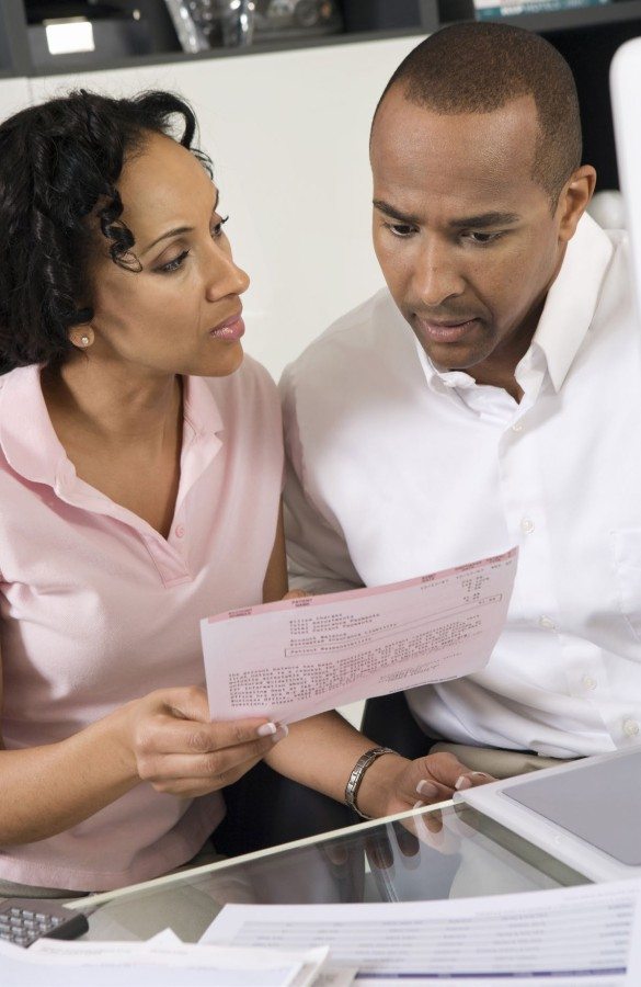 couple stressing over a bill financial crisis