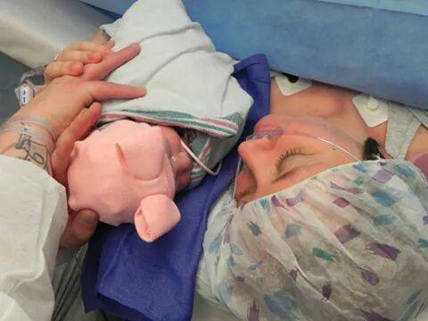 mom holding baby after c-section prep tips 