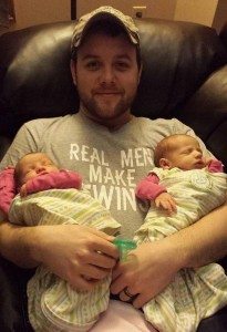 dad holding newborn twins dad's perspective on having twins